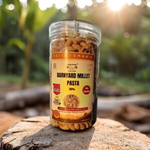 Barnyard Millet Pasta 50% front packaging jar placed outdoors on a wooden surface.