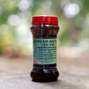 Glass jar of Mahua Preserve (Mahua Aachar) by Jai Jungle, a tribal-crafted pickle made with shade-dried Mahua flowers, cold-pressed mustard oil, and hand-pounded spices.
