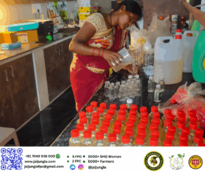 Aneshwari Bhagar, Director of Jai Jungle, filling sample bottles of Mahua sanitizer during the early COVID-19 pandemic response in Jashpur, Chhattisgarh.