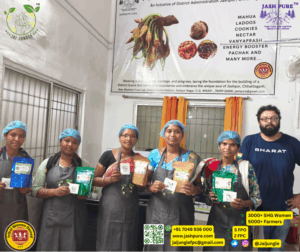 A group of tribal women at the Mahua Processing Centre in Jashpur, Chhattisgarh, proudly displaying different variants of Mahua tea and other forest-based products, led by the Jai Jungle team underA group of tribal women at the Mahua Processing Centre in Jashpur, Chhattisgarh, proudly displaying different variants of Mahua tea and other forest-based products, led by the Jai Jungle team under the Jashpure initiative. the Jashpure initiative.