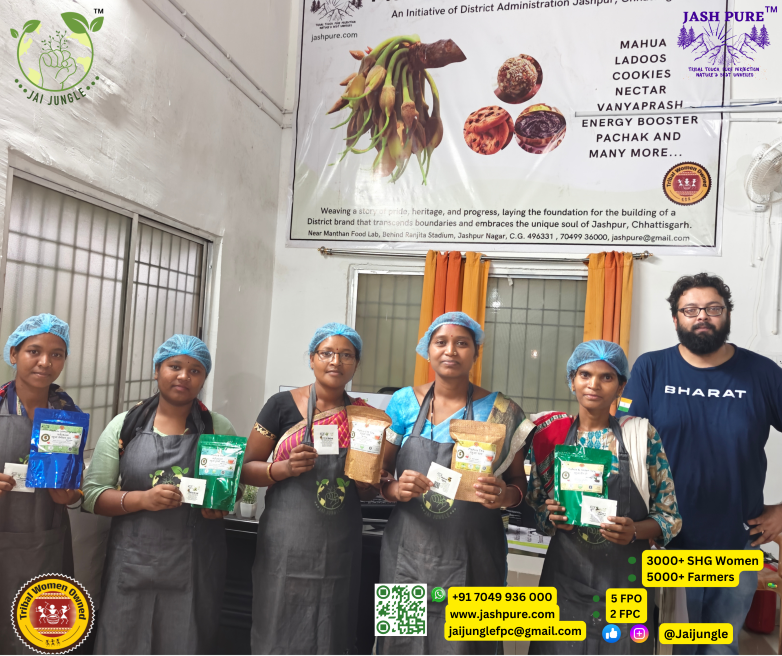 A group of tribal women at the Mahua Processing Centre in Jashpur, Chhattisgarh, proudly displaying different variants of Mahua tea and other forest-based products, led by the Jai Jungle team underA group of tribal women at the Mahua Processing Centre in Jashpur, Chhattisgarh, proudly displaying different variants of Mahua tea and other forest-based products, led by the Jai Jungle team under the Jashpure initiative. the Jashpure initiative.